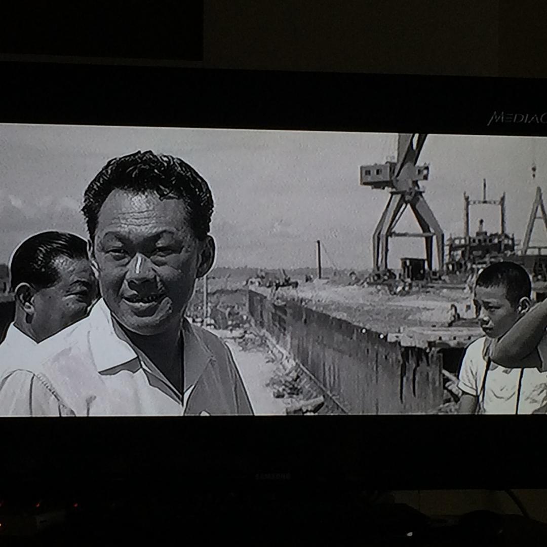 tv screen with image of two men staring