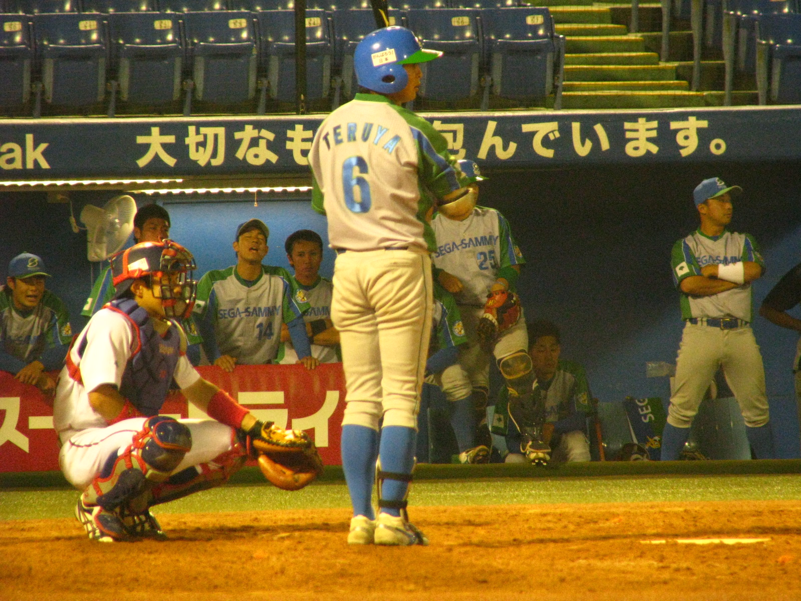 a baseball player standing next to home plate