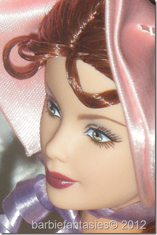 the head and shoulders of a dolls face with hair
