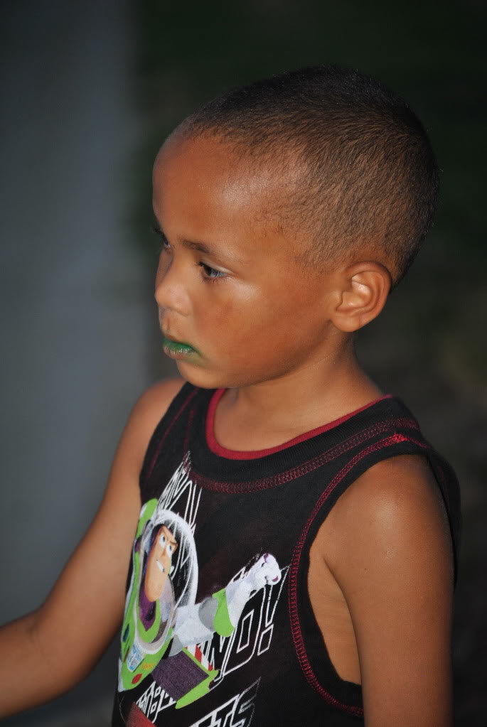 a child with his face painted green