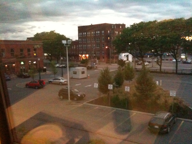 a street and road in a city during the evening