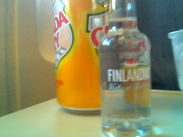 a close up of two bottles and a can