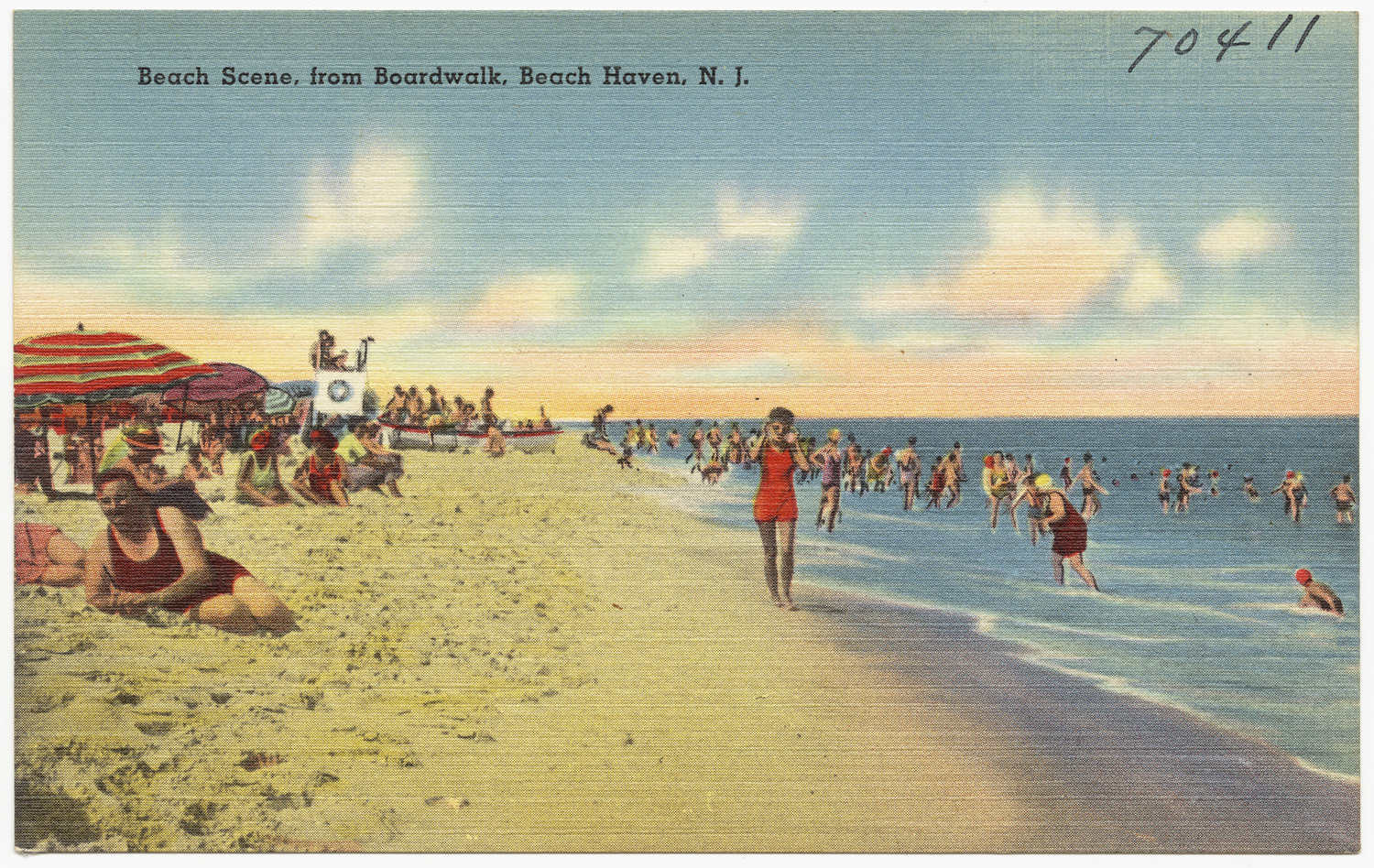 old postcard of people walking and walking on the beach