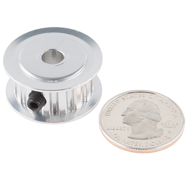 a coin and an aluminum holder on a white background