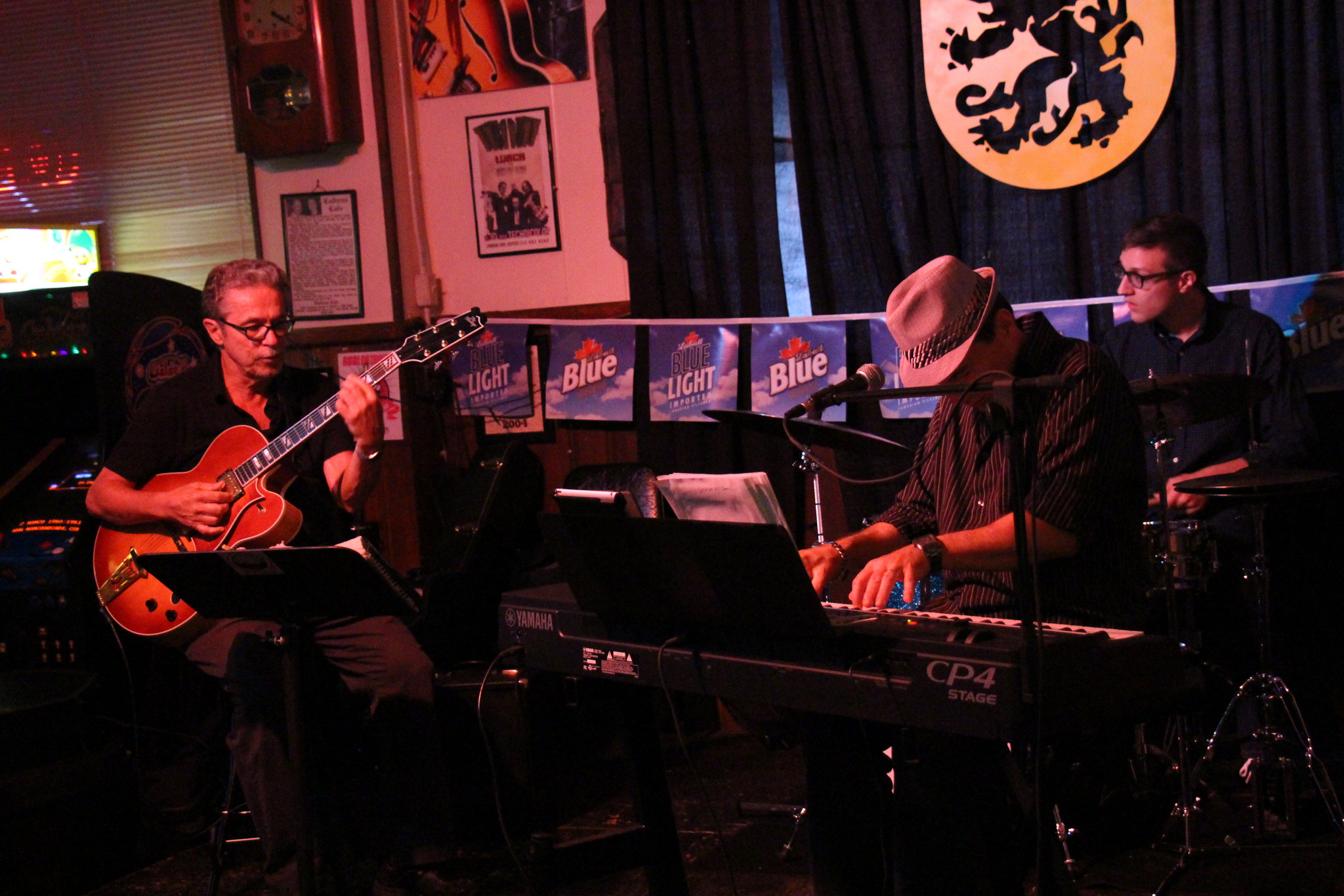 three men playing music in a band