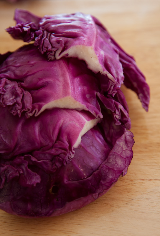 red cabbage on a  board with lots of fat inside