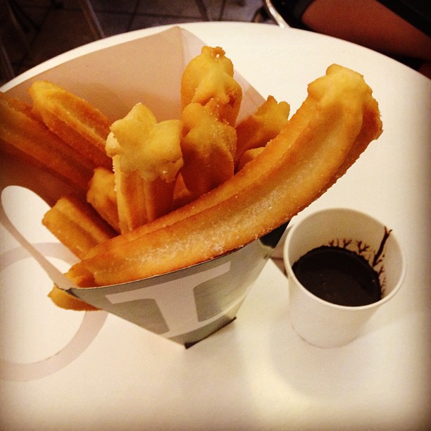there is an arrangement of fried foods that are arranged in a container