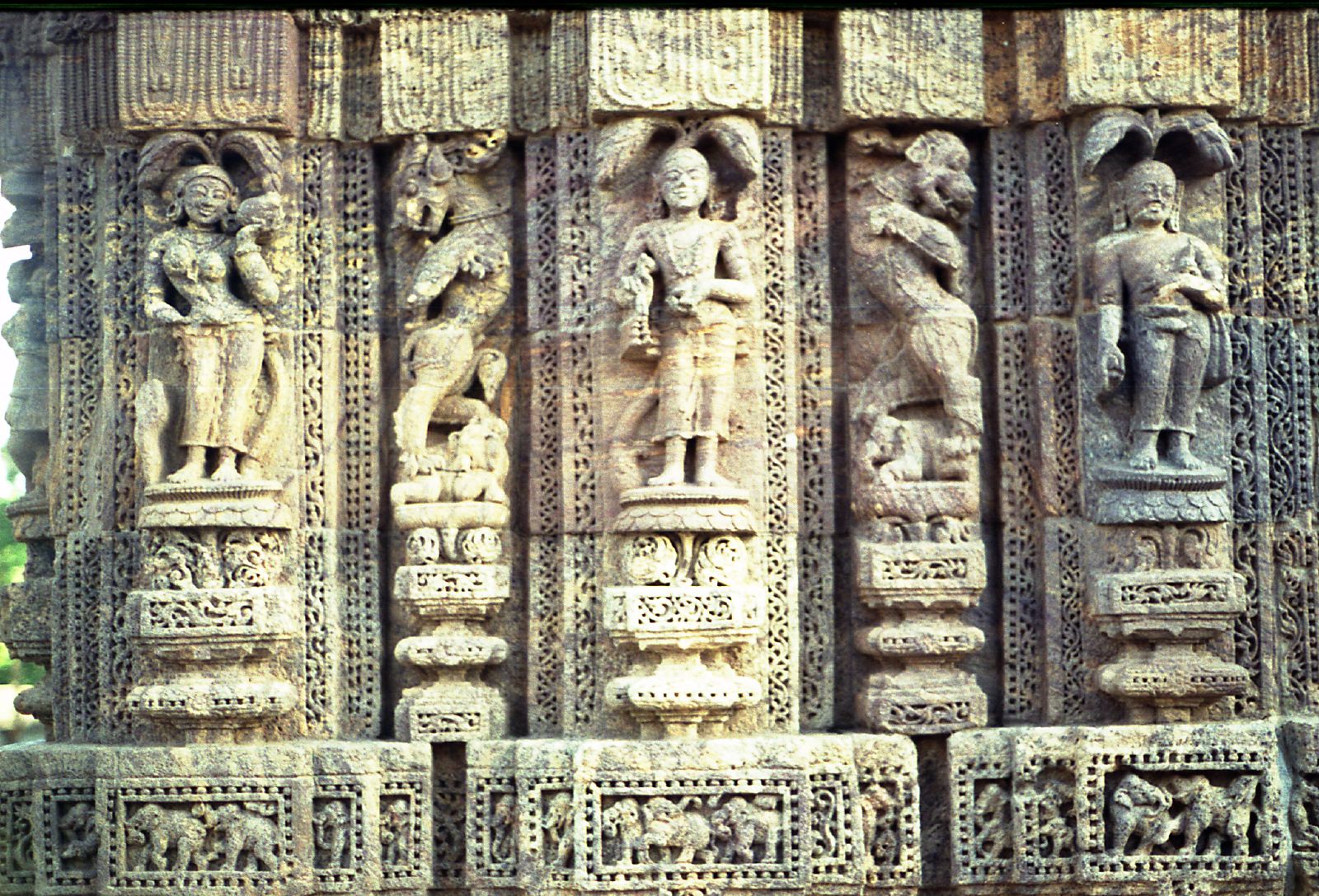 a group of carved pillars with figures on it