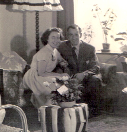 a vintage po of a man and woman sitting on a sofa