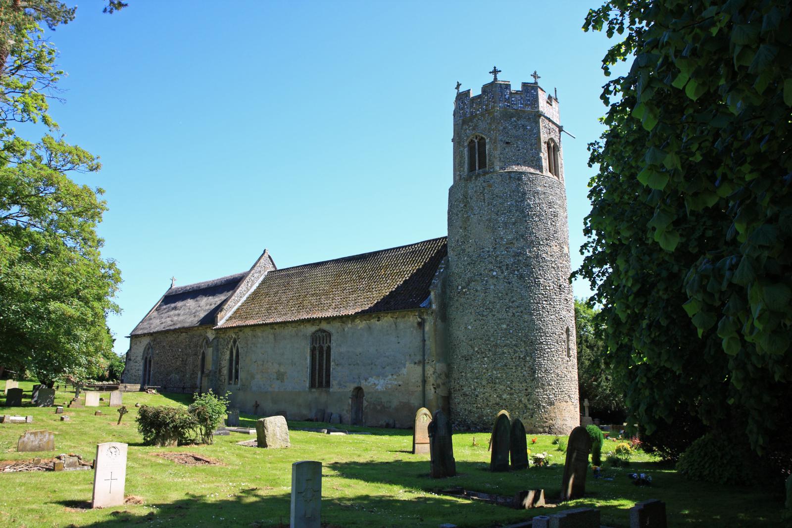 the old church has a large tower and a small steeple
