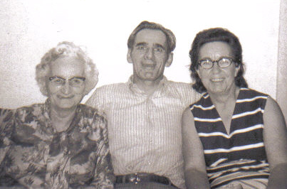 an old po of an older man with two women
