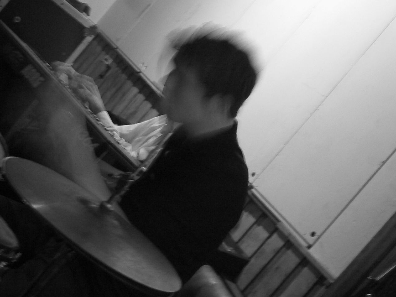 a blurry po of a person with an electronic drum set