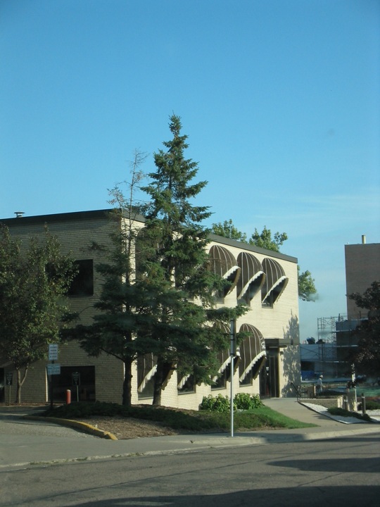 an old building is being viewed from across the street