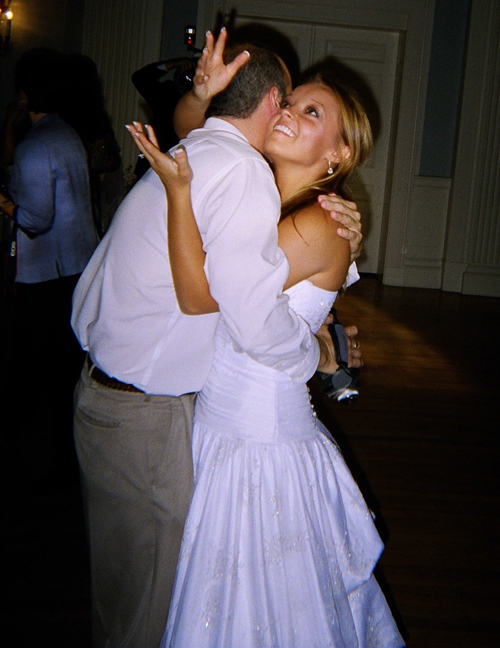 a man and woman dance on the dance floor