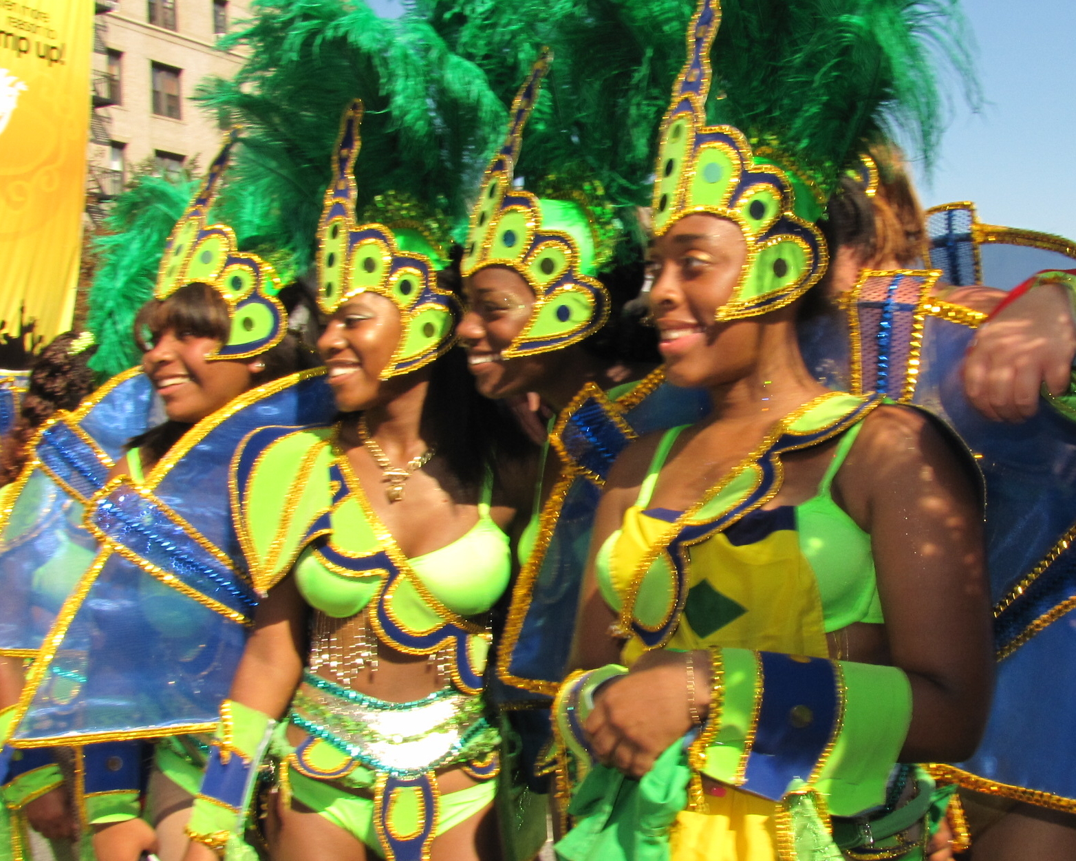 some very cute ladies with colorful costumes in a parade