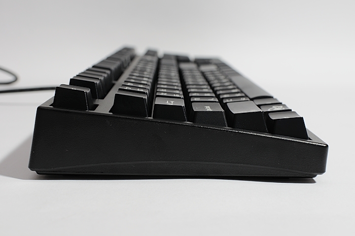 a black keyboard with three key boards sitting on the ground