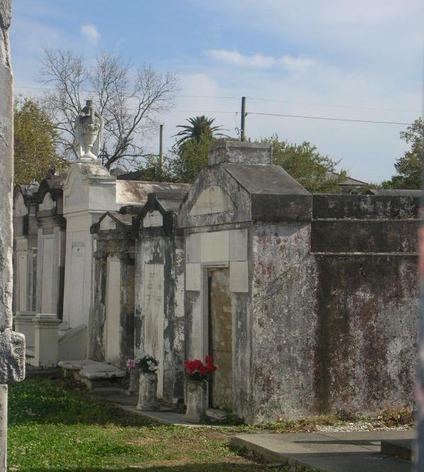 an old cemetery with a stone column and grave