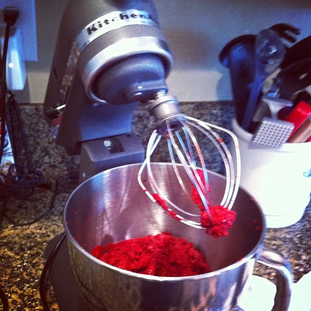the kitchen mixer has been put together and is full of red stuff