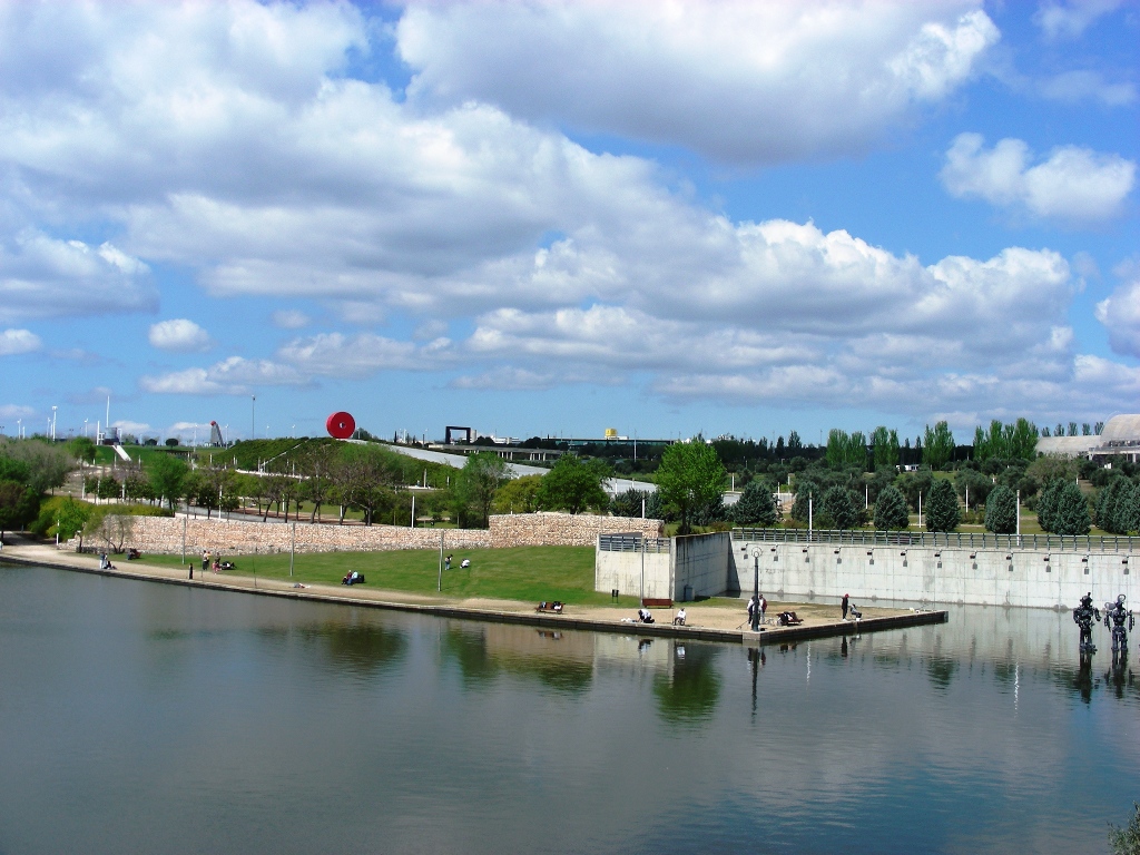 a river with a concrete wall next to it