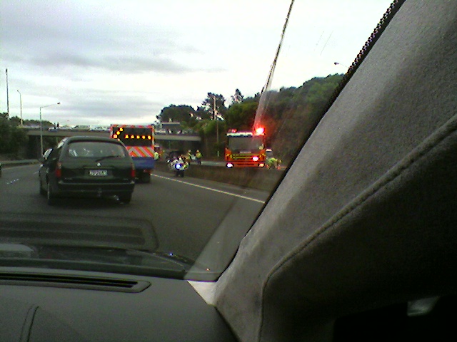 a firetruck is traveling past some emergency vehicles