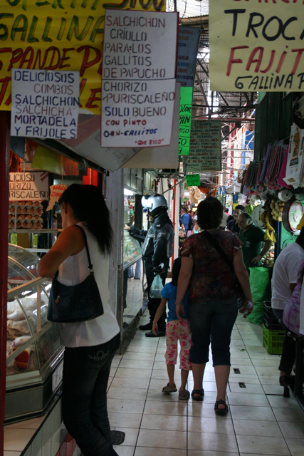 people shop for goods at the market for sale