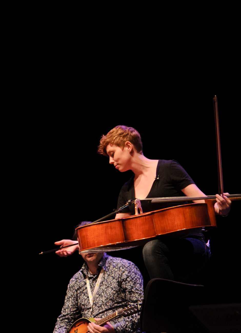 a woman and a man playing music together