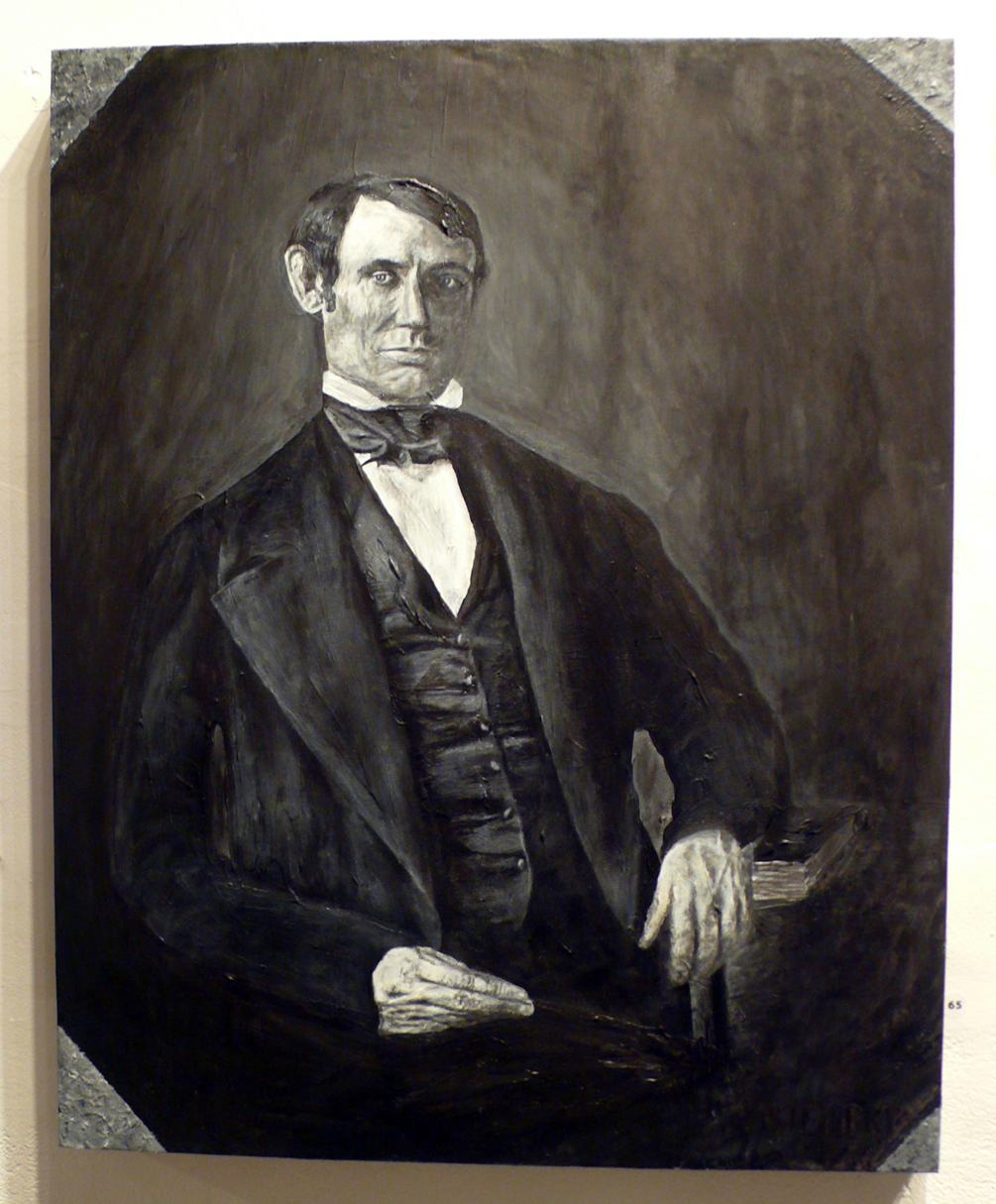a portrait of a man in a black suit and bow tie