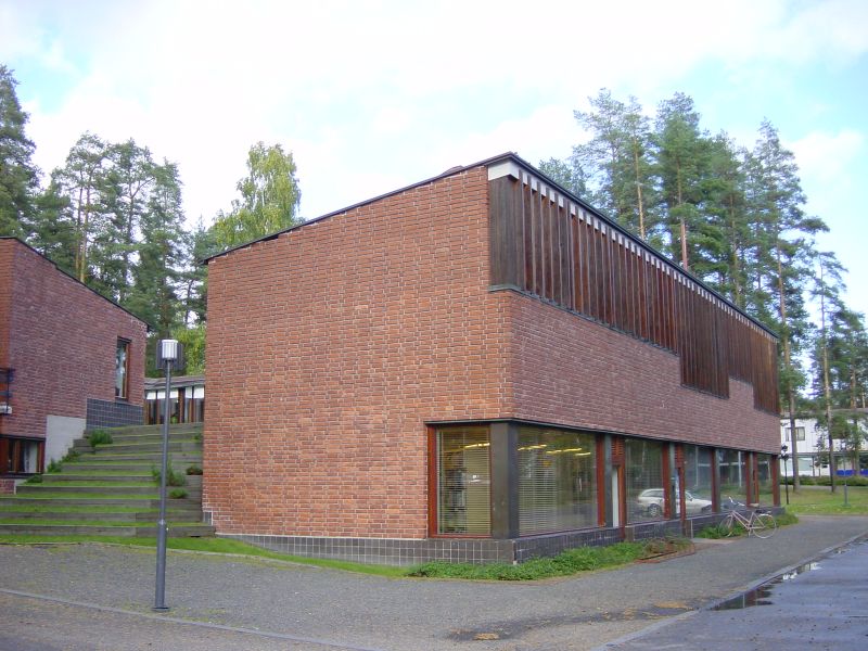 a large brick building with a stair case on the outside