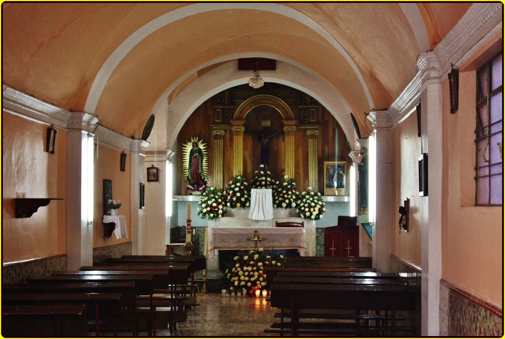 a church with an alter and tables in front