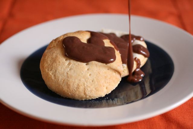 some kind of pastry with chocolate sauce drizzled on it