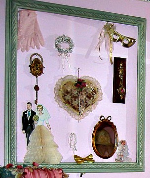 a large picture frame and some items that include dolls