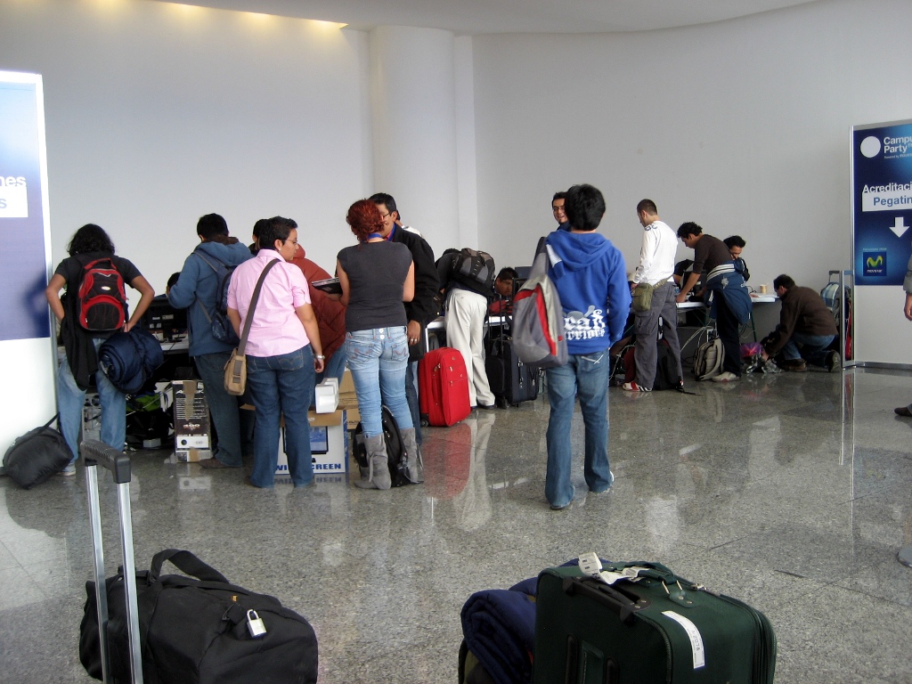 there are many people waiting in line to board the airport