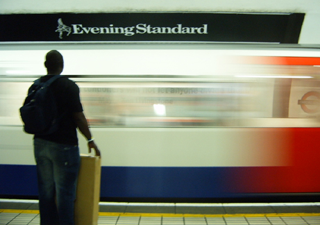 a man that is standing in the train station