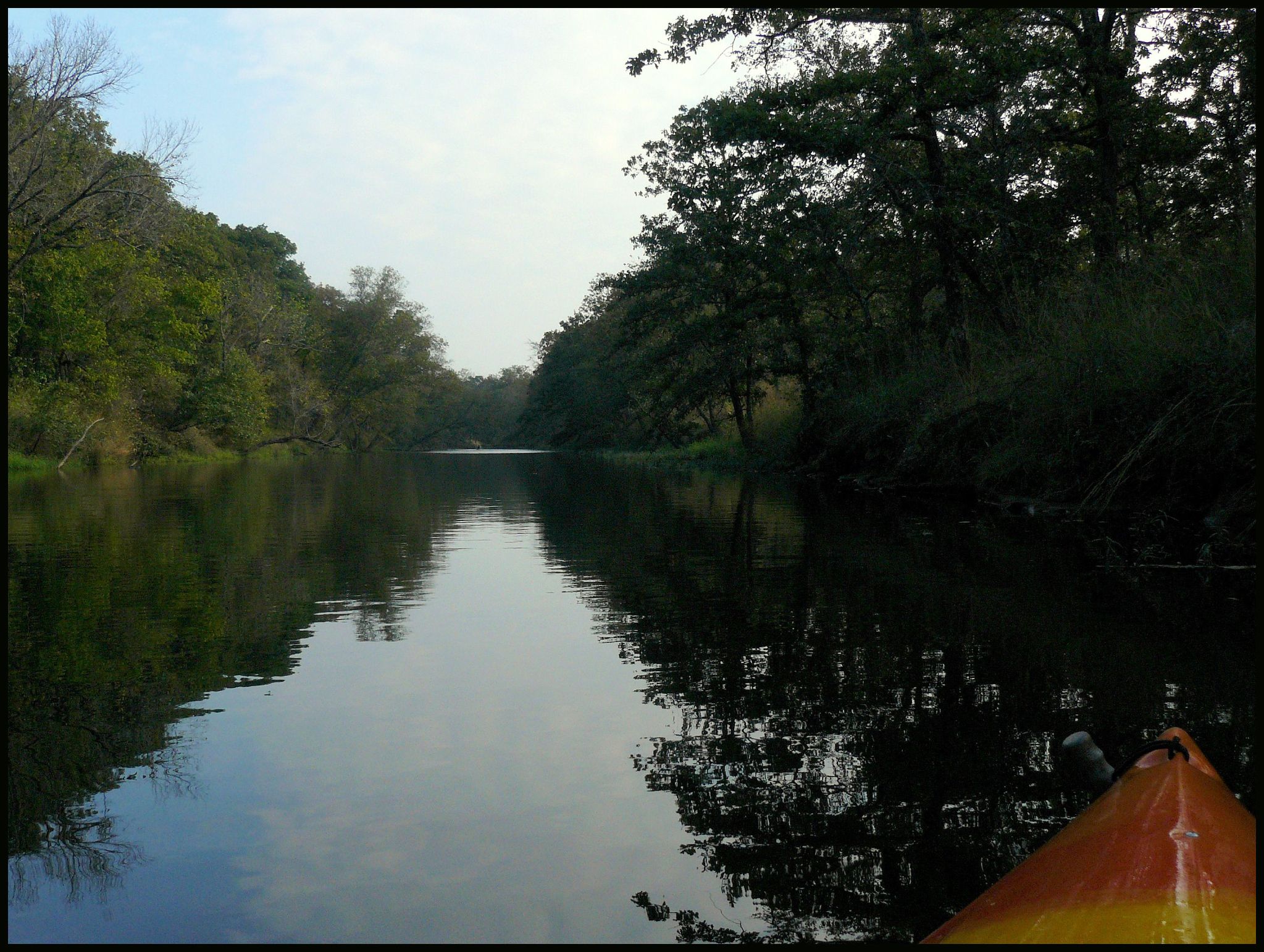 the view from the front of a boat looking down the water