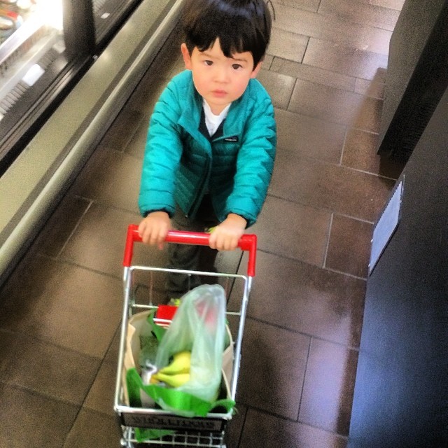 a child in a cart on the floor