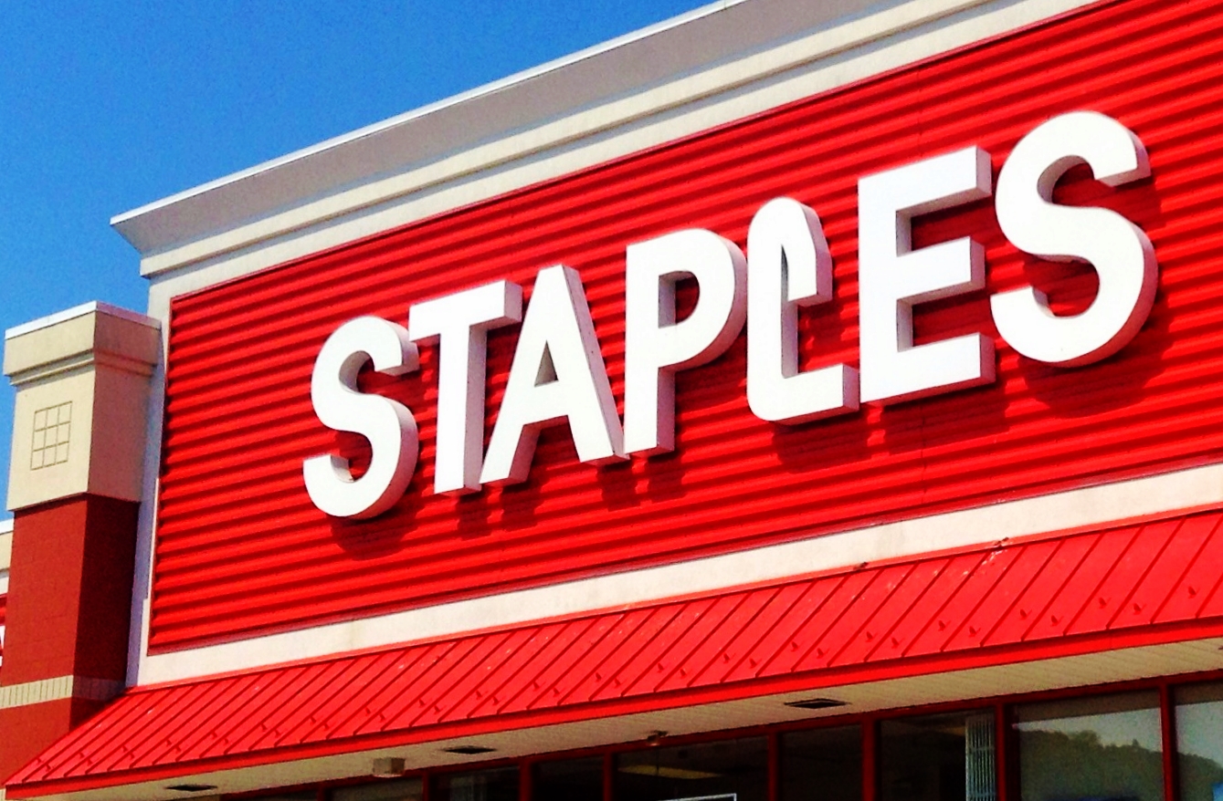 the sign on the outside of a staples clothing store