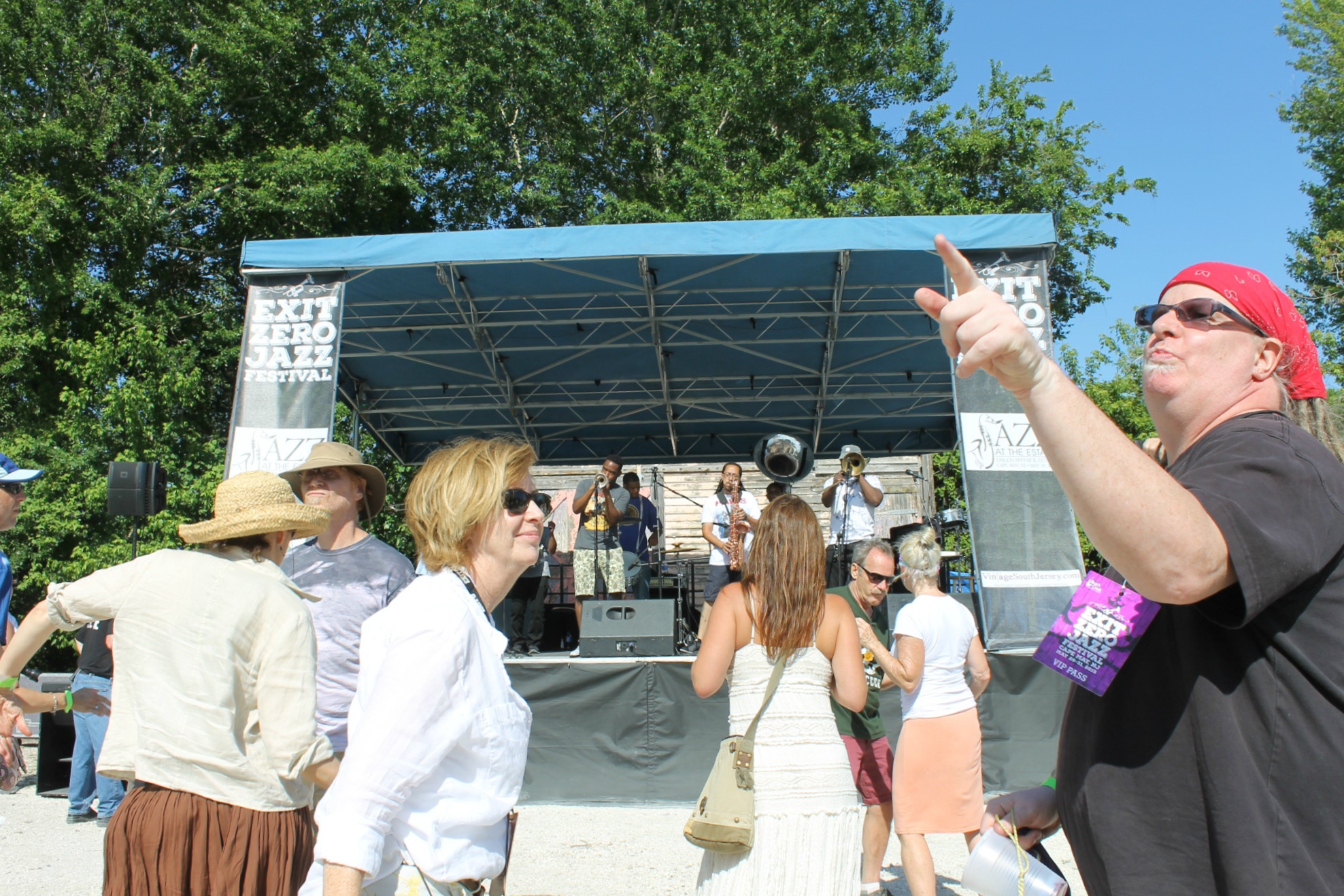 people looking at a stage that has been set up for a music concert