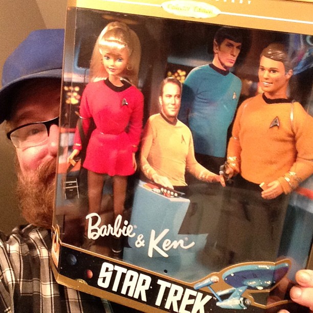 man holding up a toy from the series of tv's'star trek '