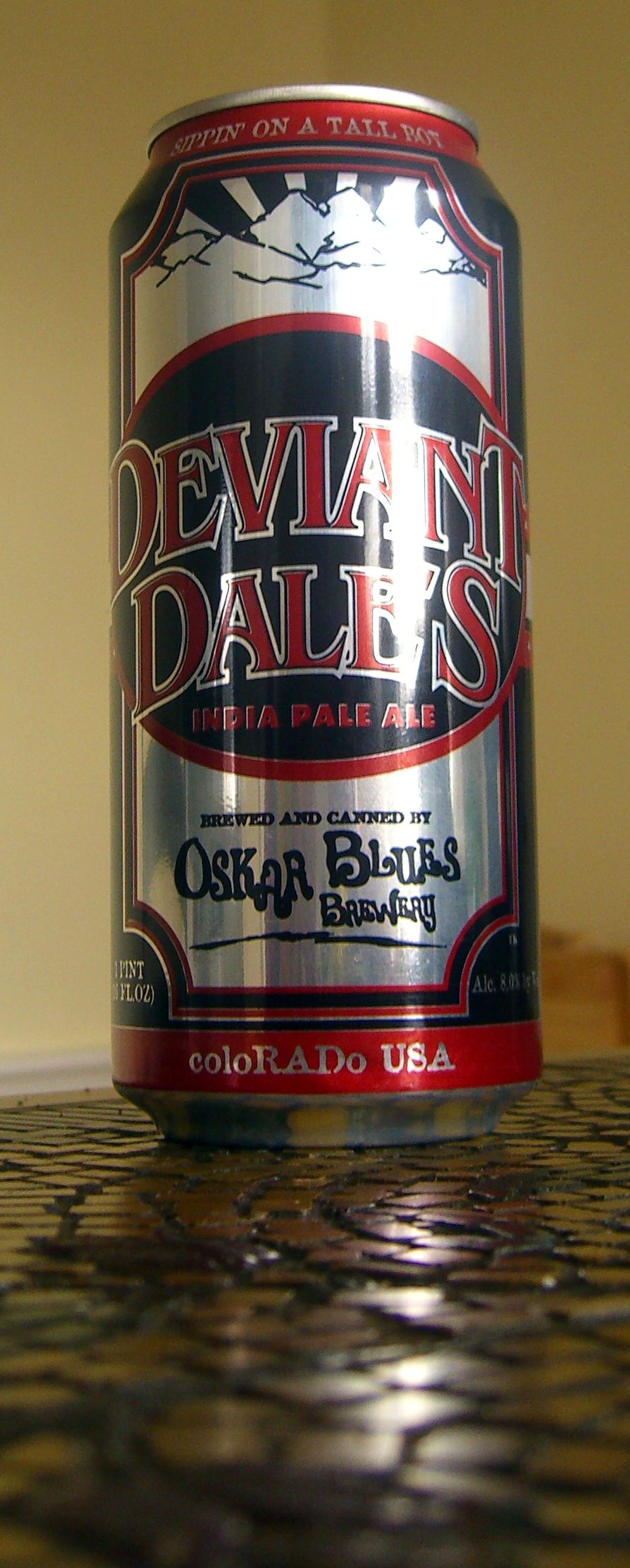 the can of devilain dalvers beer is on a tiled surface