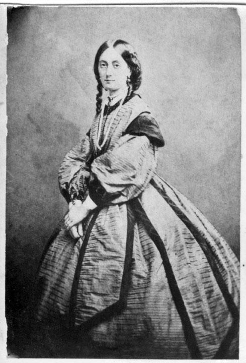 an old fashion pograph with a woman in dress