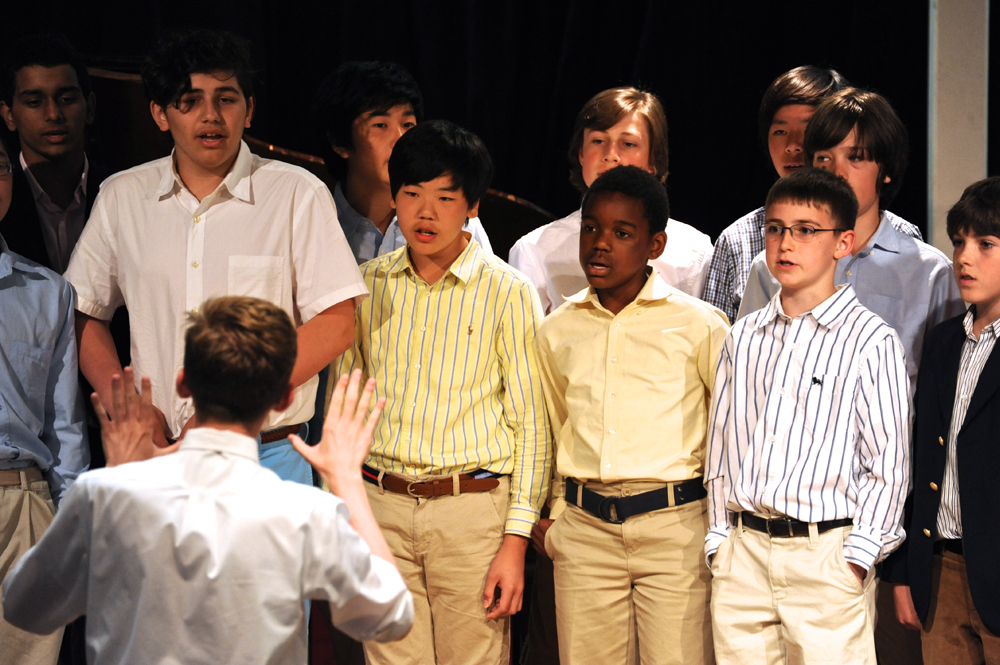 group of young children standing next to each other