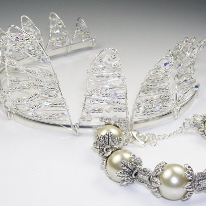 a tiara with crystal leaves and pearls