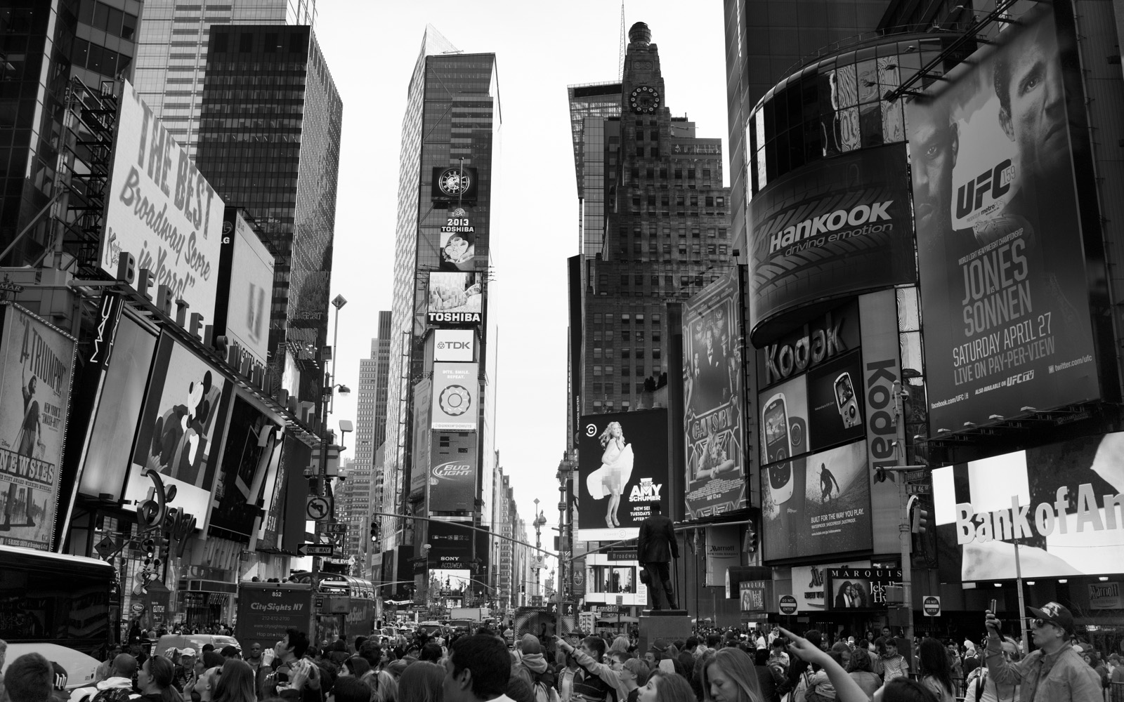 black and white pograph of crowded city street