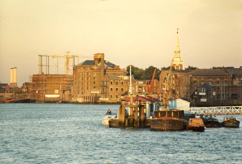 a harbor with various houses along a shore