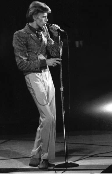 a man standing in front of a microphone