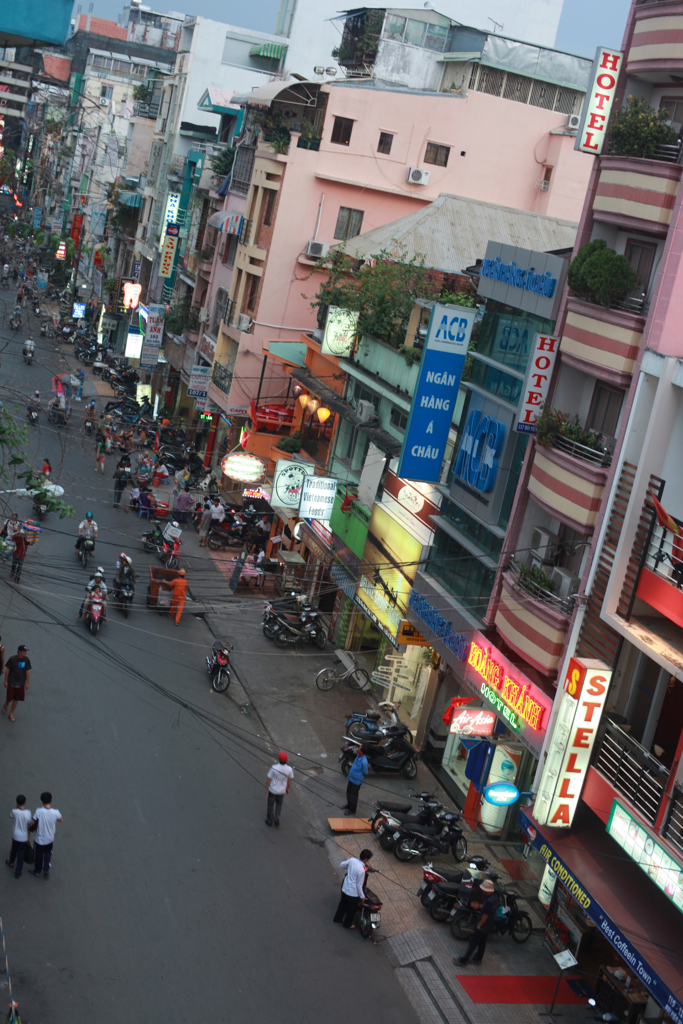 an overview view of a crowded urban street and pedestrians