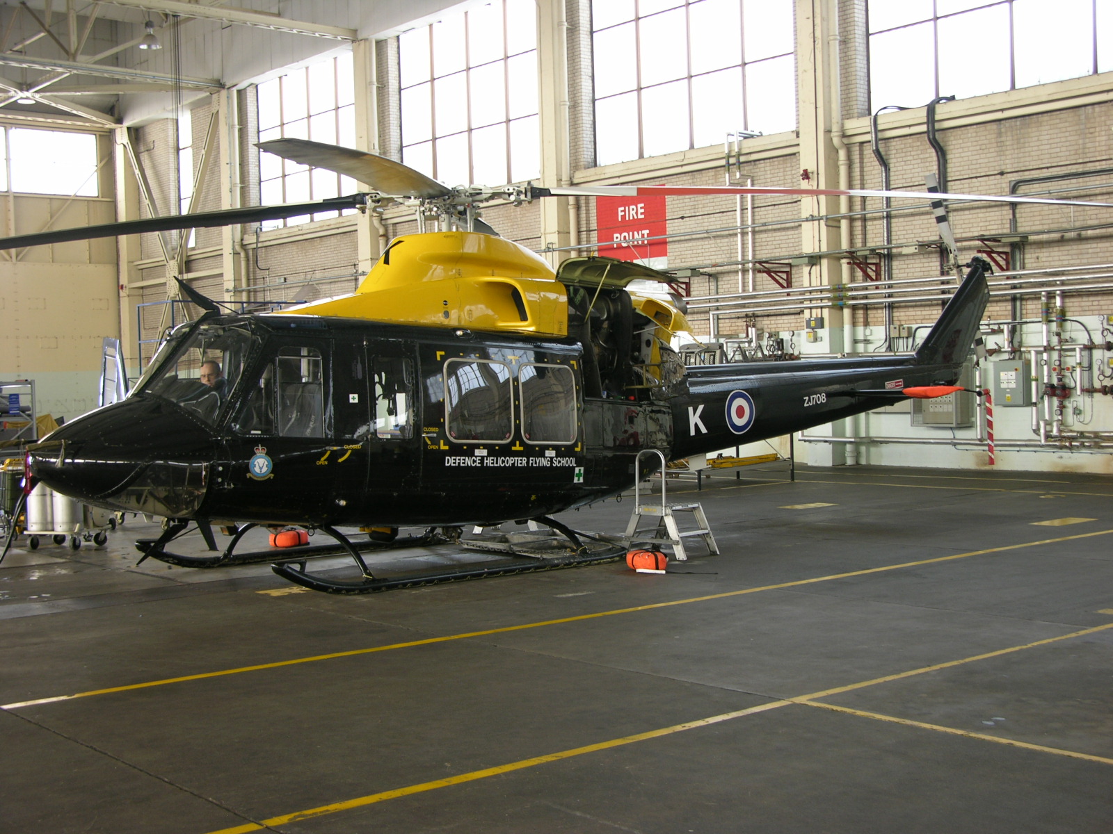 a helicopter is sitting in a hanger