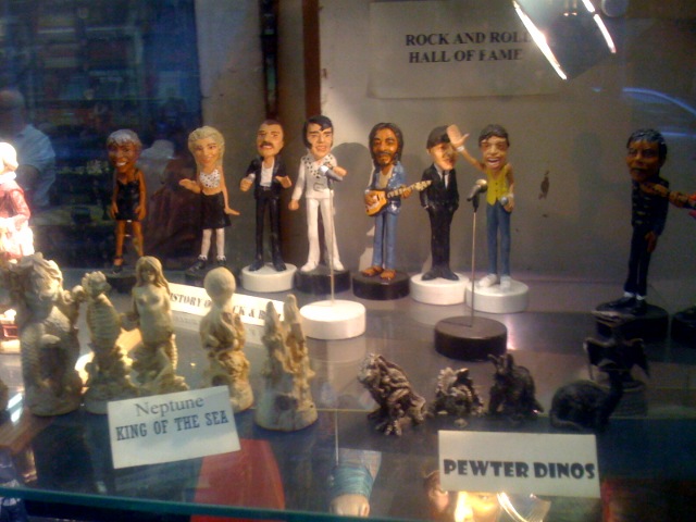 a display in a glass case of various kinds of figures