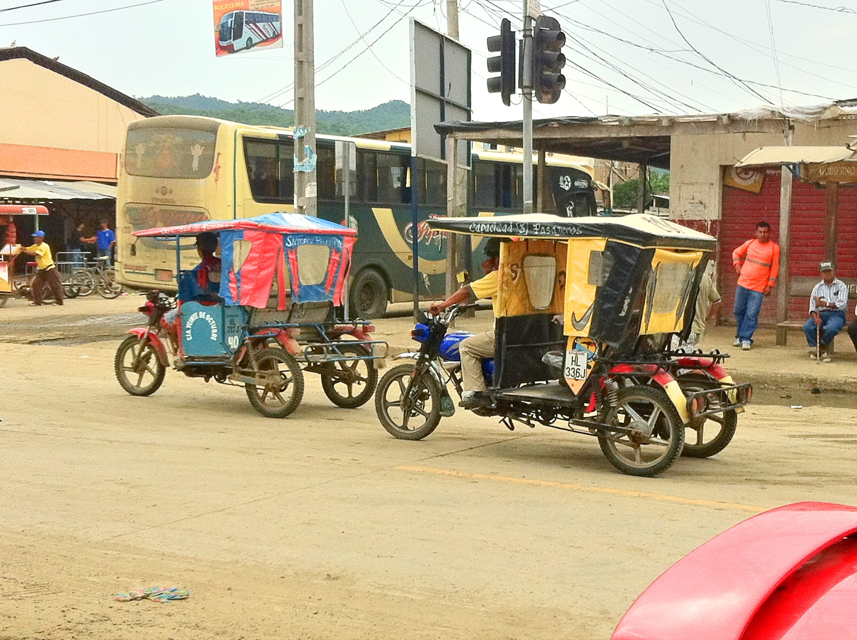 a motor cycle is driving down the street