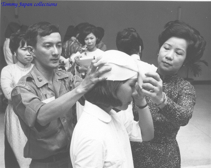 a man with a pair of scissors cuts a woman's hair